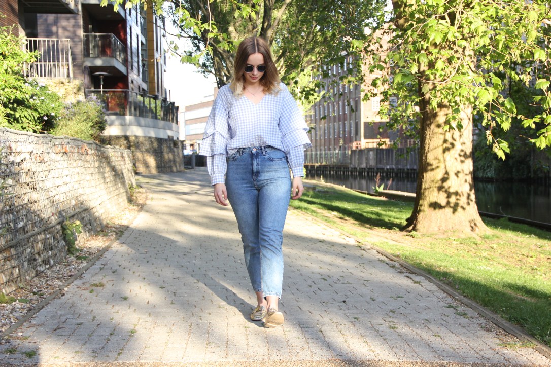 Gold loafers, gingham top and jeans