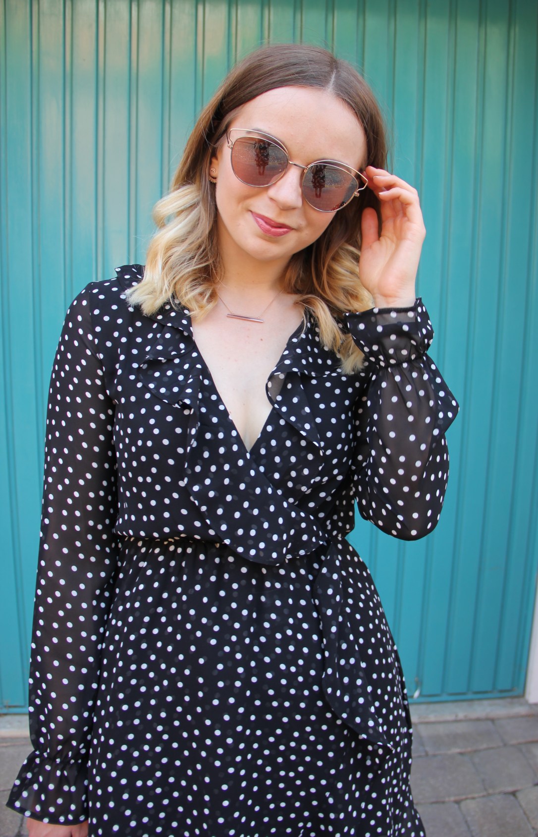 Ruffle dress and mirrored sunglasses