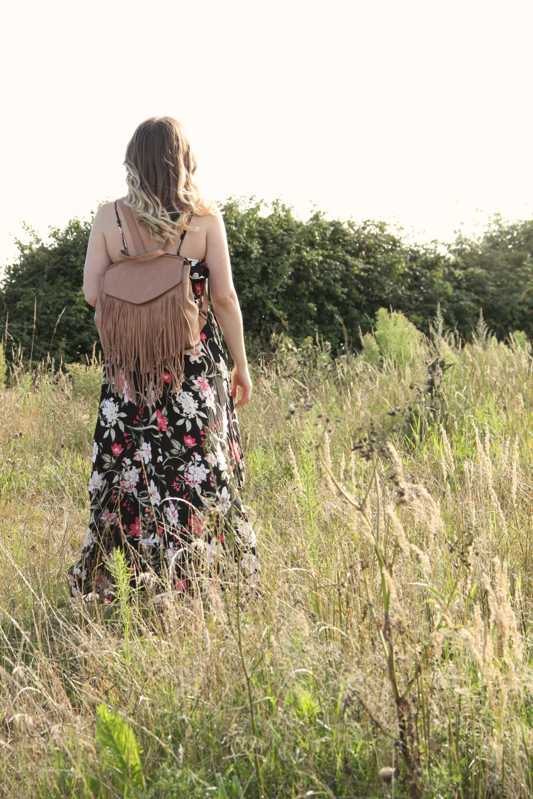 Floral maxi dress and tan bag
