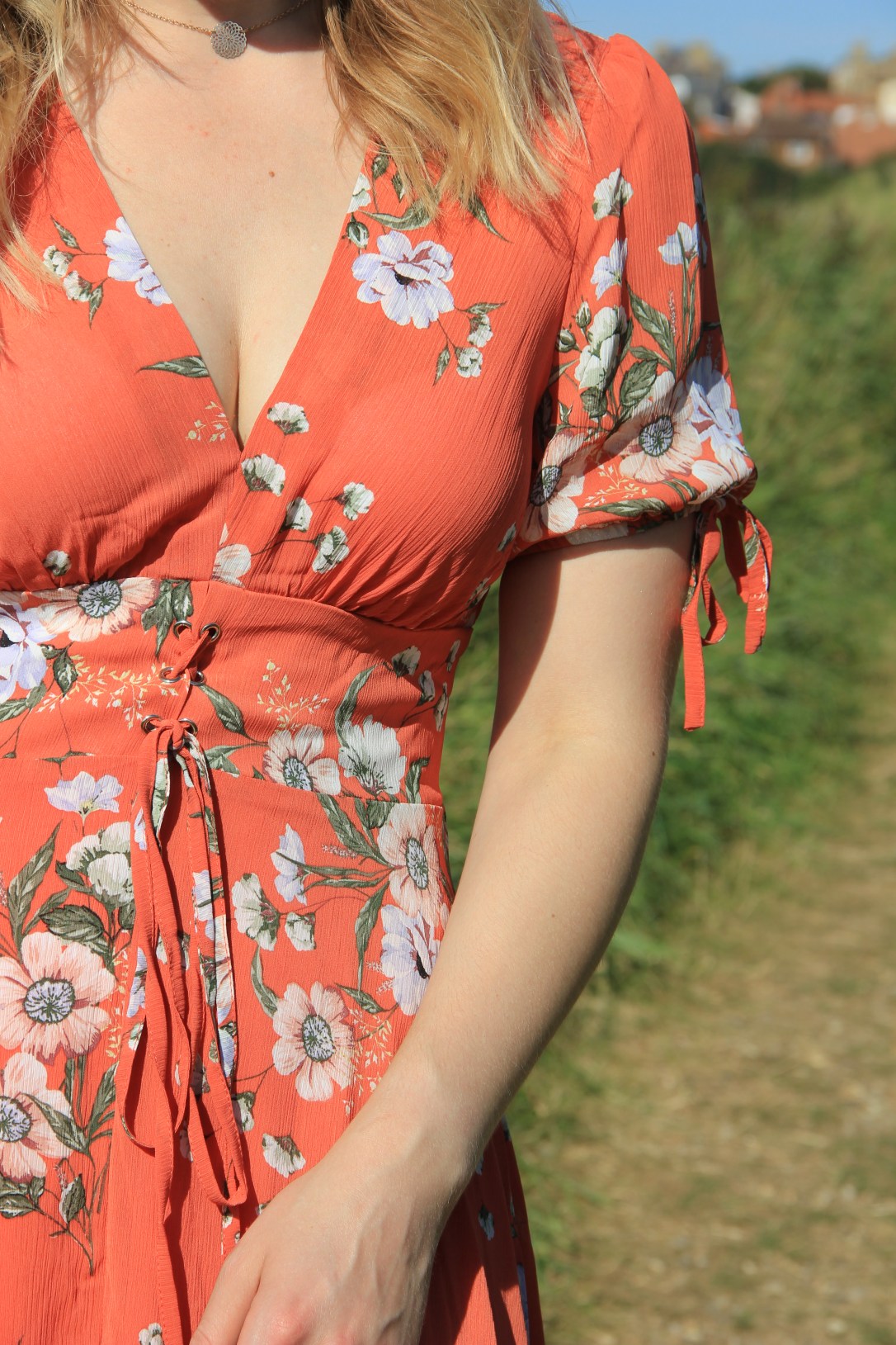 Orange floral dress with tie sleeves
