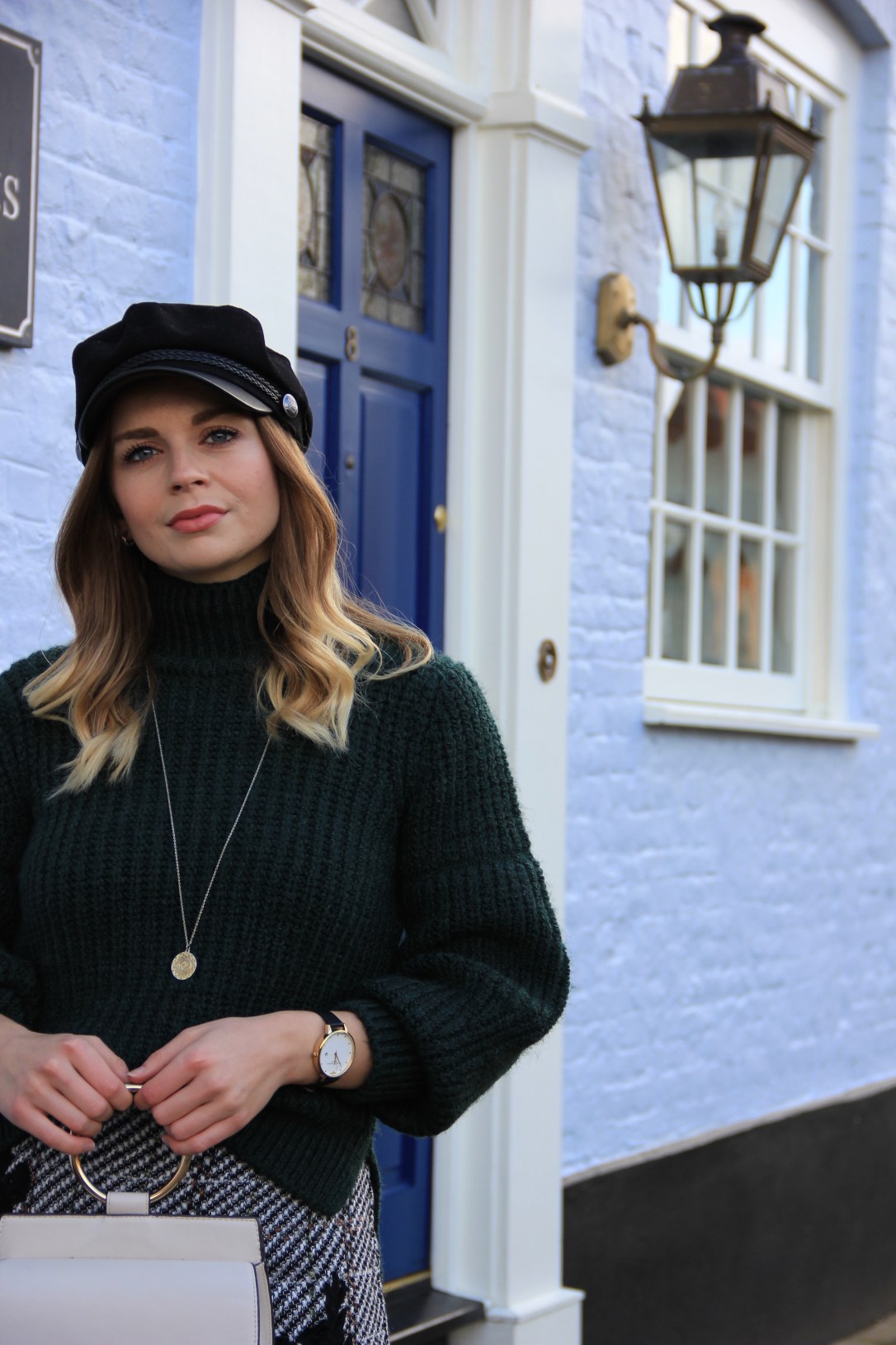 Baker boy hat and high neck jumper