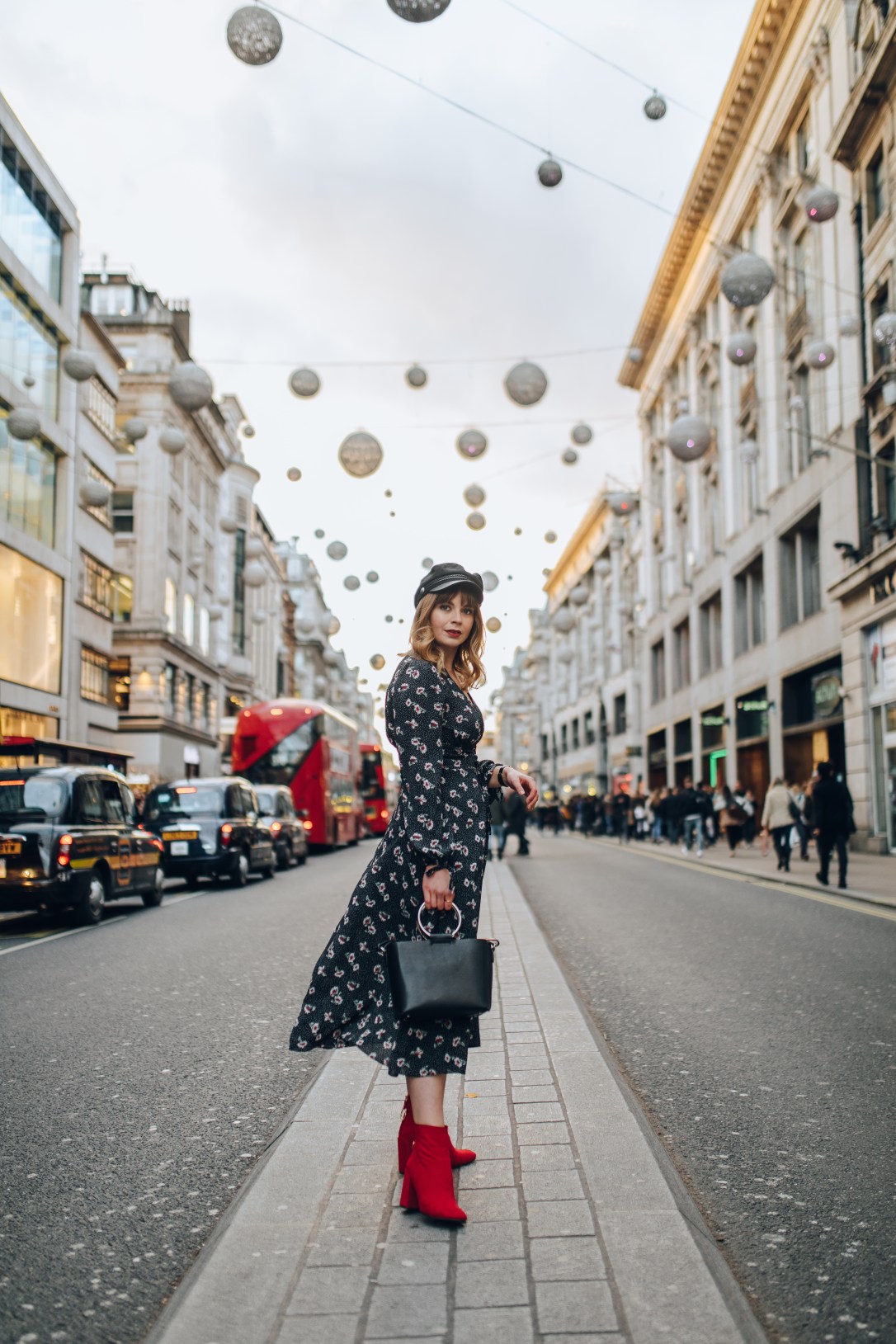 Midi dress and red boots on Oxford Street in December