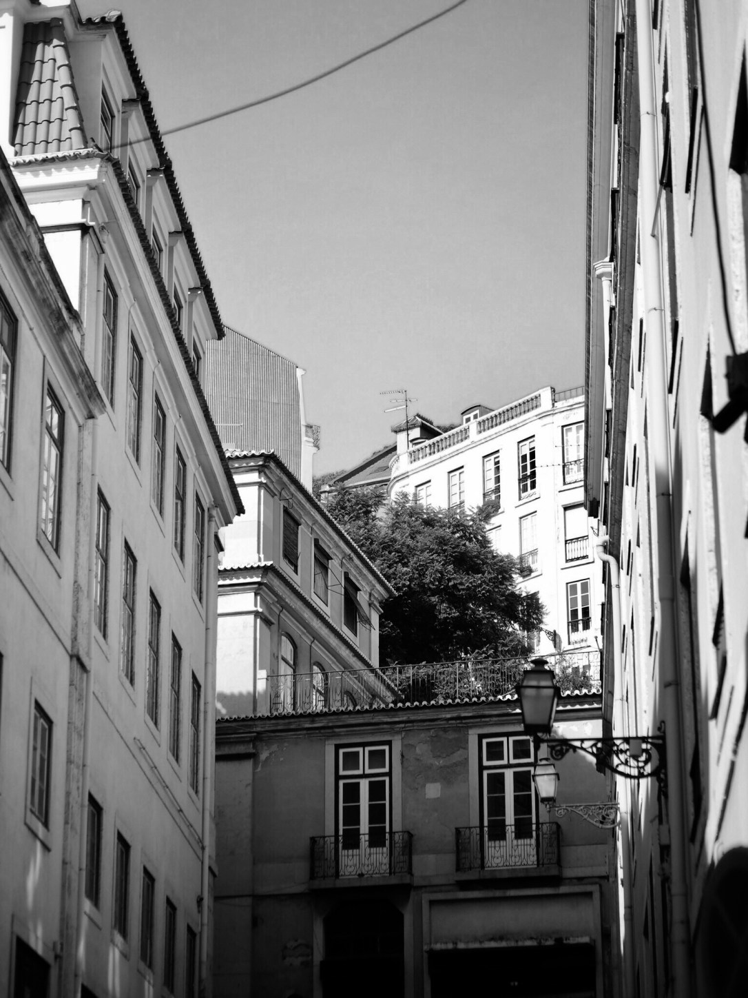 Black and white photo of street in Alfama, Lisbon
